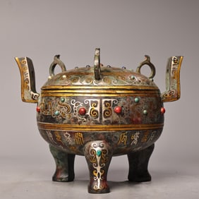 A bronze dome furnace with gold and silver inlaid with precious stones