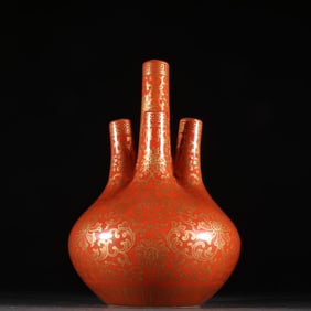 A Qing Dynasty alum red glazed gold five-mouth bottle