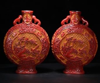 A pair of lacquerware red moon bottles