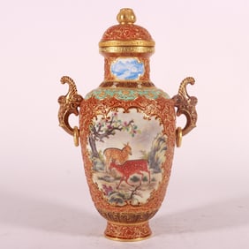 A piece of Qing Dynasty Qianlong year made enamel color alum red carved gold windowed animal amphora