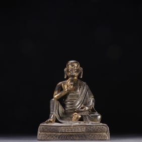 A bronze statue of a master from the Qing Dynasty