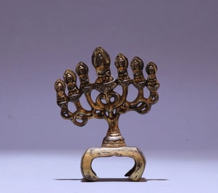 A bronze gilt seven-star Buddha