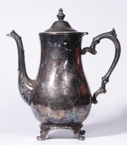 A gilt silver four-legged holding pot