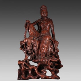 A Qing Dynasty agarwood moon Guanyin ornament