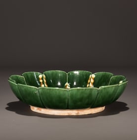 A piece of Tang Sancai's green glazed dotted lotus petal plate