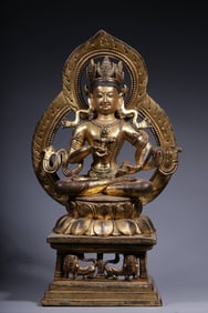 A bronze gilt Vajrasattva hammer backlit seated statue from the Qing Dynasty