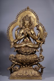 A bronze gilt six-armed Guanyin backlit statue from the Qing Dynasty