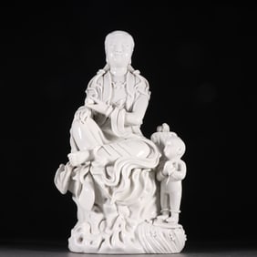 A Dehua porcelain Guanyin statue of the child