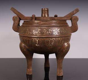 A piece of gold and silver bronze tripods of the Han Dynasty