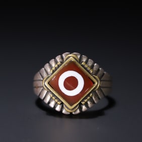 An old silver and red agate dzi ring