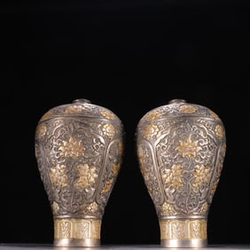 A pair of gilded and engraved floral plum vases from the Tang Dynasty