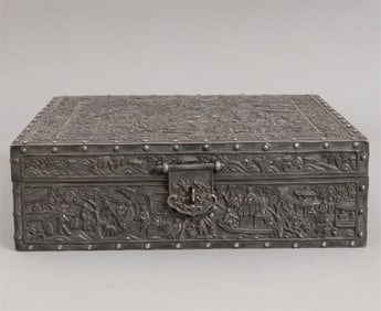 A silver box engraved in high relief