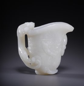 A Hetian jade dragon pattern wine vessel from the Qing Dynasty