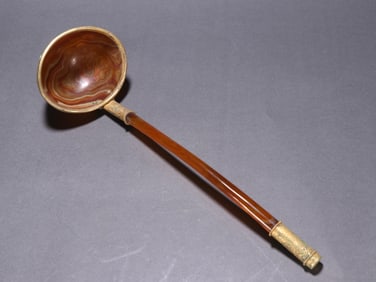 One piece of agate wrapped in gold spoon