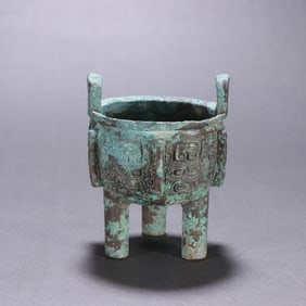 A bronze beast face ding