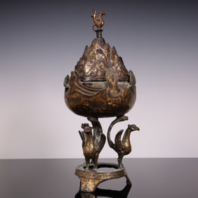 A piece of the Han Dynasty bronze cuo gold and silver three-legged incense burner