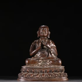 A bronze and silver Guru Buddha from the Qing Dynasty