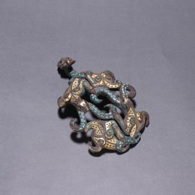 A piece of bronze and silver inlaid turquoise with hooks from the Han Dynasty