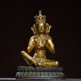 A bronze gilt statue of Green Tara