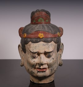 A Tang Dynasty bronze three-color Buddha head