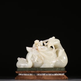 A Qing Dynasty Hetian jade boy playing goose ornament