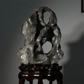 A delicate Taihu stone ornament
