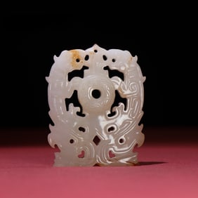 A beautiful white jade double dragon pendant