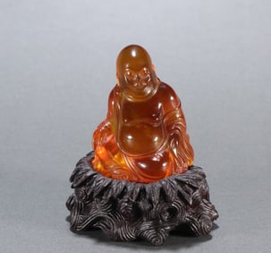 An amber cloth bag Arhat ornament from the Qing Dynasty