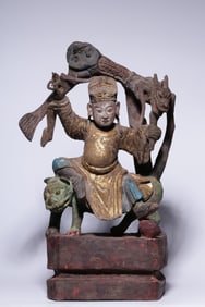 A statue of the King of Wood Carved and Lacquered Gold Medicine King from the Qing Dynasty