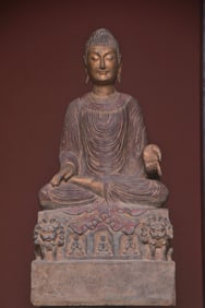 A beautiful bluestone painted statue of the Buddha