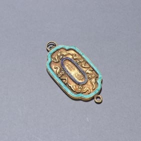 A bronze gilt turquoise fasting plaque from the Qing Dynasty