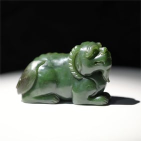 A Qing Dynasty Hetian jasper beast ornament