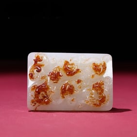 A delicate Hetian jade white jade red dragon buckle