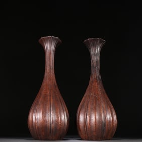 A pair of rosewood flower arrangements from the Qing Dynasty