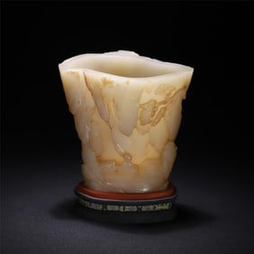 A piece of Hetian jade embossed landscape figure horn cup from the Qing Dynasty