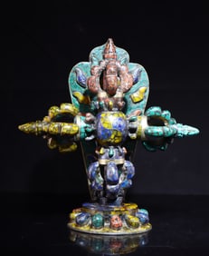 A beautiful gem-encrusted cross vajra vessel