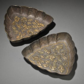 A pair of fine old sterling silver gilt floral plates