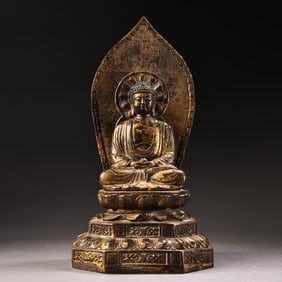 An all-bronze high-relief carved image of the Buddha in lacquer
