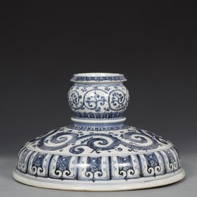A blue and white curly grass pattern official hat seat made in the Yongle year of the Ming Dynasty