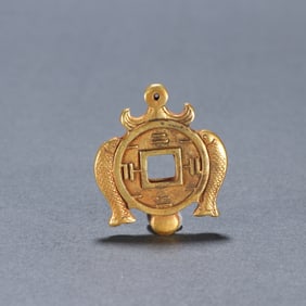 A fine bronze gilt Pisces coin