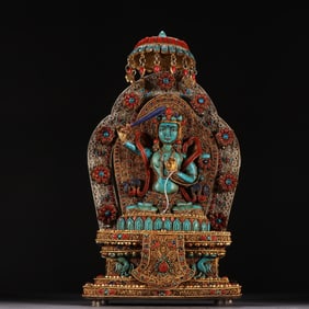 A silver-gilt filigree inlaid turquoise Tara statue from the Qing Dynasty