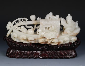 A boat-shaped ornament of Hetian jade seed material figure from the Qing Dynasty