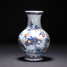 A piece of the Qing Dynasty Yongzheng year of the official kiln bucket color pomegranate bottle