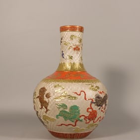 A beautifully carved lion hydrangea painted gold celestial ball vase