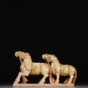A Liaojin Hetian jade gold-filled double horse ornament
