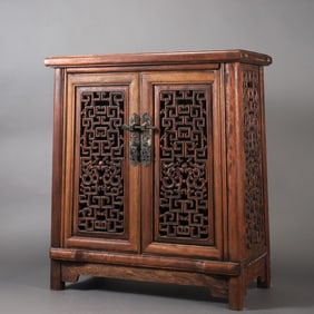 A beautifully carved wood-carved openwork cabinet