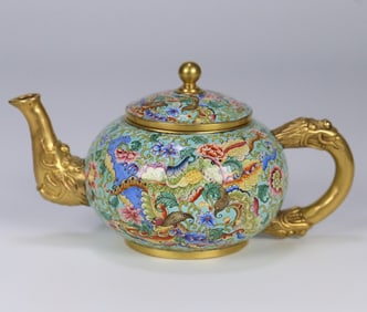 A bronze fetal painting enamel entwined flower dragon head pot made in the Qianlong year of the Qing