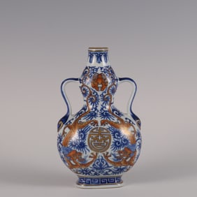 A blue and white alum red depicted gold red dragon holding longevity gourd bottle made in the