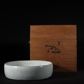 A piece of the Song Dynasty's official kiln moon white glaze pile carved dragon pattern large circle