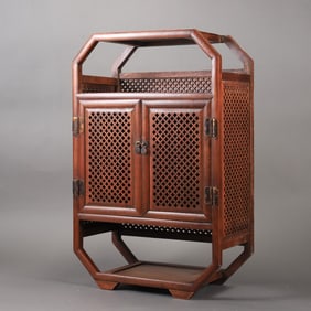 A beautifully carved wood-carved openwork cabinet
